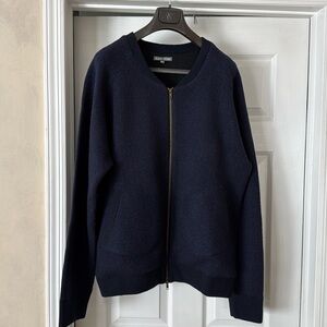 Front zipper sweater jacket. 95% wool and 5% cashmere. Lightly worn looks new.